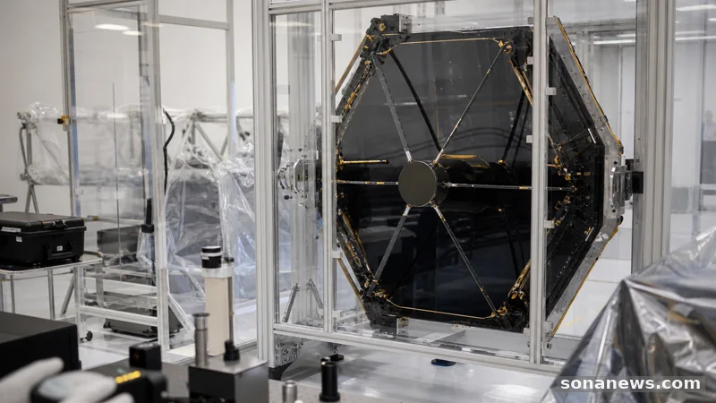 Spacecraft integration room with protected telescope mirror and inspection equipment, illustrating NASA Roman Space Telescope final launch checks.